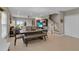 Open-concept living room with dining area, staircase, and plenty of natural light at 320 Primrose Dr, Davenport, FL 33837