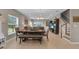 Open living space features dining table and staircase, creating a welcoming and bright atmosphere at 320 Primrose Dr, Davenport, FL 33837