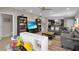 Open-concept living room featuring sofas, a ceiling fan, and entertainment center at 320 Primrose Dr, Davenport, FL 33837