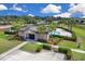 Aerial view of community pool with inviting lounge area, surrounded by palm trees and well-maintained landscaping at 320 Primrose Dr, Davenport, FL 33837