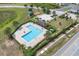 A refreshing community pool featuring ample seating and a covered pavilion for relaxation at 320 Primrose Dr, Davenport, FL 33837