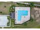 Aerial view of community pool and recreation area, highlighting the pool's unique shape and size at 320 Primrose Dr, Davenport, FL 33837