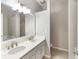 Bright bathroom featuring double vanity with white marble countertop and chrome fixtures at 328 Appaloosa Ct, Sanford, FL 32773