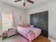 Cozy bedroom featuring a ceiling fan and closet with sliding doors at 328 Appaloosa Ct, Sanford, FL 32773