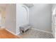 Bright foyer featuring neutral walls, tiled floors, and a cozy bench, creating a welcoming entrance at 328 Appaloosa Ct, Sanford, FL 32773