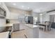 Modern kitchen with white cabinets, stainless steel appliances, and a center island, ideal for cooking and entertaining at 328 Appaloosa Ct, Sanford, FL 32773