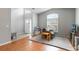 Spacious living room with abundant natural light, neutral walls, and hardwood floors, perfect for gatherings at 328 Appaloosa Ct, Sanford, FL 32773