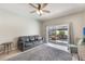 Comfortable living room with tiled floors, a ceiling fan, and sliding doors leading to the patio, great for relaxing at 328 Appaloosa Ct, Sanford, FL 32773