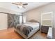 Serene main bedroom featuring hardwood floors, a sliding barn door, and neutral decor, creating a relaxing retreat at 328 Appaloosa Ct, Sanford, FL 32773