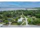 An aerial view showcasing this house with a picturesque street and stunning waterfront views at 335 Debary Ave, Debary, FL 32713