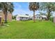 Large backyard with a swing set and mature trees at 335 Debary Ave, Debary, FL 32713