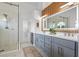 Modern bathroom featuring double vanity, a glass-enclosed shower, and stylish fixtures at 335 Debary Ave, Debary, FL 32713