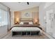 Serene bedroom with shiplap accent wall, soft lighting, and cozy bedding at 335 Debary Ave, Debary, FL 32713