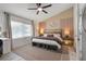 Bright bedroom featuring a ceiling fan, large window, and calming decor at 335 Debary Ave, Debary, FL 32713
