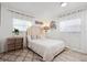 Bright bedroom with modern decor and natural light, featuring hardwood floors and stylish curtains at 335 Debary Ave, Debary, FL 32713
