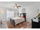 Cozy bedroom features a ceiling fan, accent rug, and a charming wall decor, creating a relaxing atmosphere at 335 Debary Ave, Debary, FL 32713