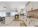 Bright kitchen with stainless steel appliances, granite countertops, and a decorative backsplash at 335 Debary Ave, Debary, FL 32713