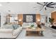Inviting living room featuring stylish decor, comfortable seating, and modern ceiling fan at 335 Debary Ave, Debary, FL 32713