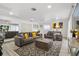 Relaxing living room featuring stylish furniture, modern artwork, and plenty of space for entertaining at 335 Debary Ave, Debary, FL 32713