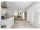 Open concept living room featuring modern decor, light wood floors, and plenty of natural light at 335 Debary Ave, Debary, FL 32713