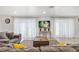 Comfortable living room area with a sofa, wooden coffee table, and a modern entertainment center at 335 Debary Ave, Debary, FL 32713