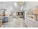 Open-concept kitchen and living room with modern finishes, plenty of natural light, and stylish furnishings at 335 Debary Ave, Debary, FL 32713