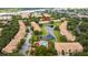 A high angle showcasing the neighborhood amenities, and a large lake in the distance at 3567 Shallot Dr # 103, Orlando, FL 32835