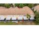 Aerial view of townhome featuring private screened patio with patio and an air conditioning unit at 3567 Shallot Dr # 103, Orlando, FL 32835