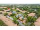 Aerial view of the community with pool, pond, and surrounding townhomes at 3567 Shallot Dr # 103, Orlando, FL 32835