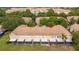 Aerial view of townhome community featuring well-maintained roofs, landscaping, and private screened patios at 3567 Shallot Dr # 103, Orlando, FL 32835