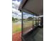 Screened back porch with scenic views of the lake and lush surroundings at 3567 Shallot Dr # 103, Orlando, FL 32835