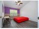 Bedroom with laminate floors, desk, ceiling fan and large window at 3567 Shallot Dr # 103, Orlando, FL 32835
