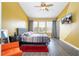 Well lit bedroom features a ceiling fan, a queen bed and neutral colored linens at 3567 Shallot Dr # 103, Orlando, FL 32835