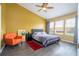 Bedroom features a ceiling fan, a queen bed, neutral linens and large windows at 3567 Shallot Dr # 103, Orlando, FL 32835