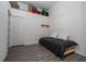 Bedroom featuring a lofted storage area, closet, and laminate floors at 3567 Shallot Dr # 103, Orlando, FL 32835