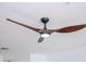 A close-up view of a modern ceiling fan with a wooden finish at 3567 Shallot Dr # 103, Orlando, FL 32835