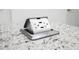 Granite countertop featuring a hidden power outlet with USB ports at 3567 Shallot Dr # 103, Orlando, FL 32835