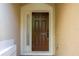Inviting front door with sidelight and modern digital lock at 3567 Shallot Dr # 103, Orlando, FL 32835