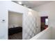 Hallway with textured accent wall, two doors and view to bedroom at 3567 Shallot Dr # 103, Orlando, FL 32835