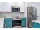 Modern kitchen features stainless steel appliances and granite countertops at 3567 Shallot Dr # 103, Orlando, FL 32835