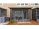 Close-up of a screened-in lanai with comfortable outdoor seating and a ceiling fan at 3567 Shallot Dr # 103, Orlando, FL 32835