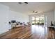 Spacious living room with hardwood floors and sliding glass doors to a lanai at 3567 Shallot Dr # 103, Orlando, FL 32835