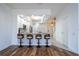 Open floor plan with kitchen, living room, bar seating, and stairs at 3567 Shallot Dr # 103, Orlando, FL 32835