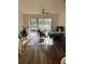 Bright and airy living room featuring hardwood floors and sliding glass doors at 3567 Shallot Dr # 103, Orlando, FL 32835