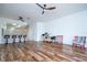 Bright living room with wood flooring and kitchen with bar seating at 3567 Shallot Dr # 103, Orlando, FL 32835