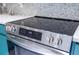 Close up of kitchen range with digital display and stainless steel knobs at 3567 Shallot Dr # 103, Orlando, FL 32835