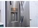Stainless steel refrigerator with water and ice dispenser in a modern kitchen at 3567 Shallot Dr # 103, Orlando, FL 32835