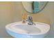 Close-up of the bathroom sink with a stylish faucet and round mirror at 3567 Shallot Dr # 103, Orlando, FL 32835