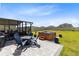 Spacious backyard with a hot tub, patio, and outdoor seating for relaxation and entertainment at 3829 Allegany Ln, Sanford, FL 32771