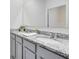Bathroom showcasing double sinks with granite countertops, providing a modern and functional space at 3829 Allegany Ln, Sanford, FL 32771